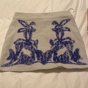 MINI SKIRT W BLUE DESIGN. SUPER CUTE DESIGN WEAVE. This skirt turns heads!